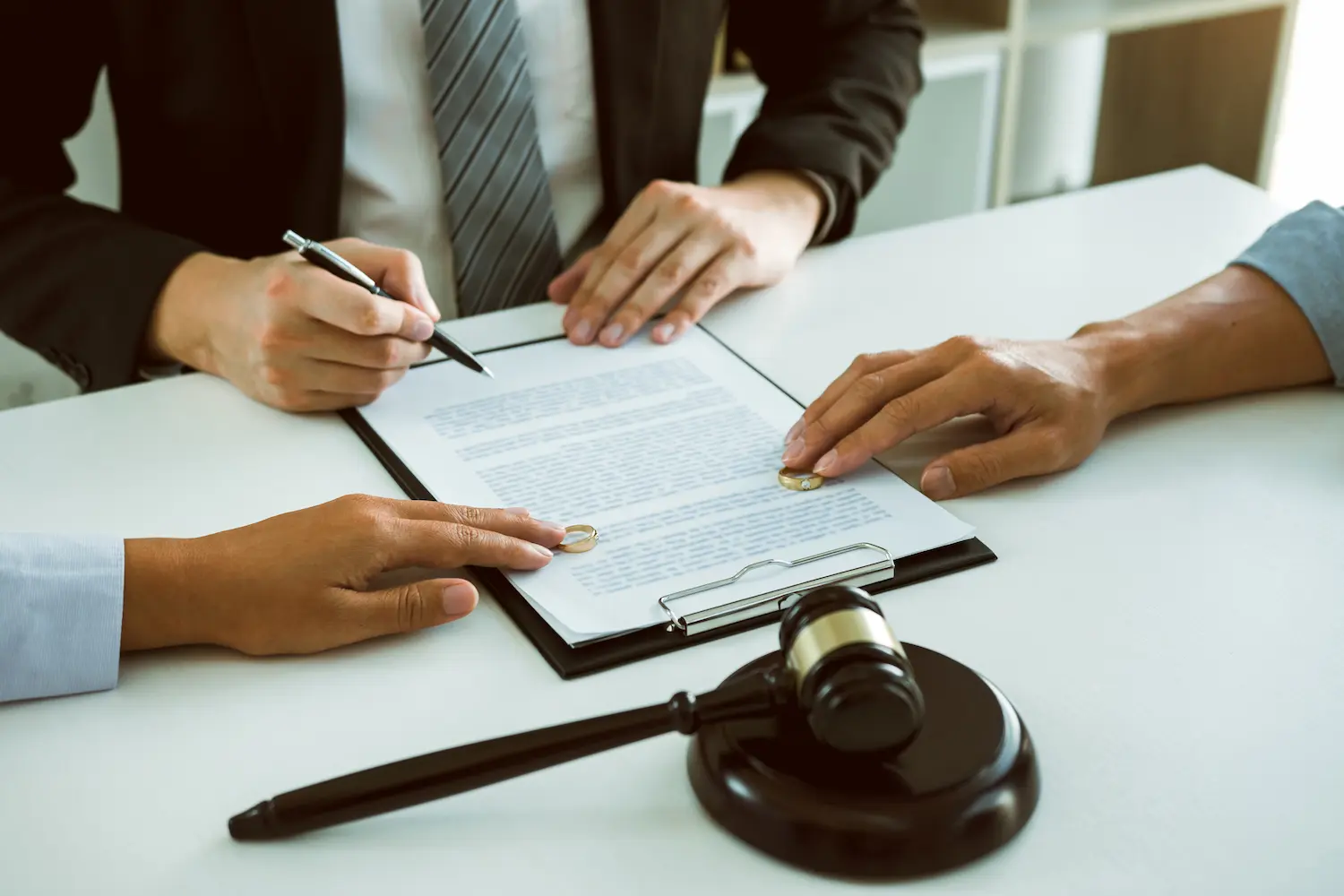 A couple preparing documents for divorce with Real Divorce Solutions.