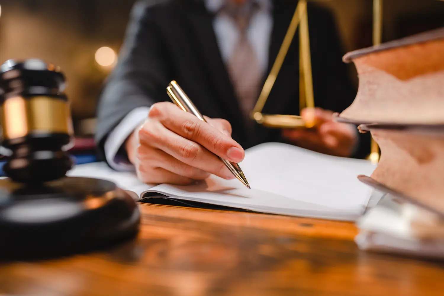 Real Divorce Solutions lawyer taking notes in court.