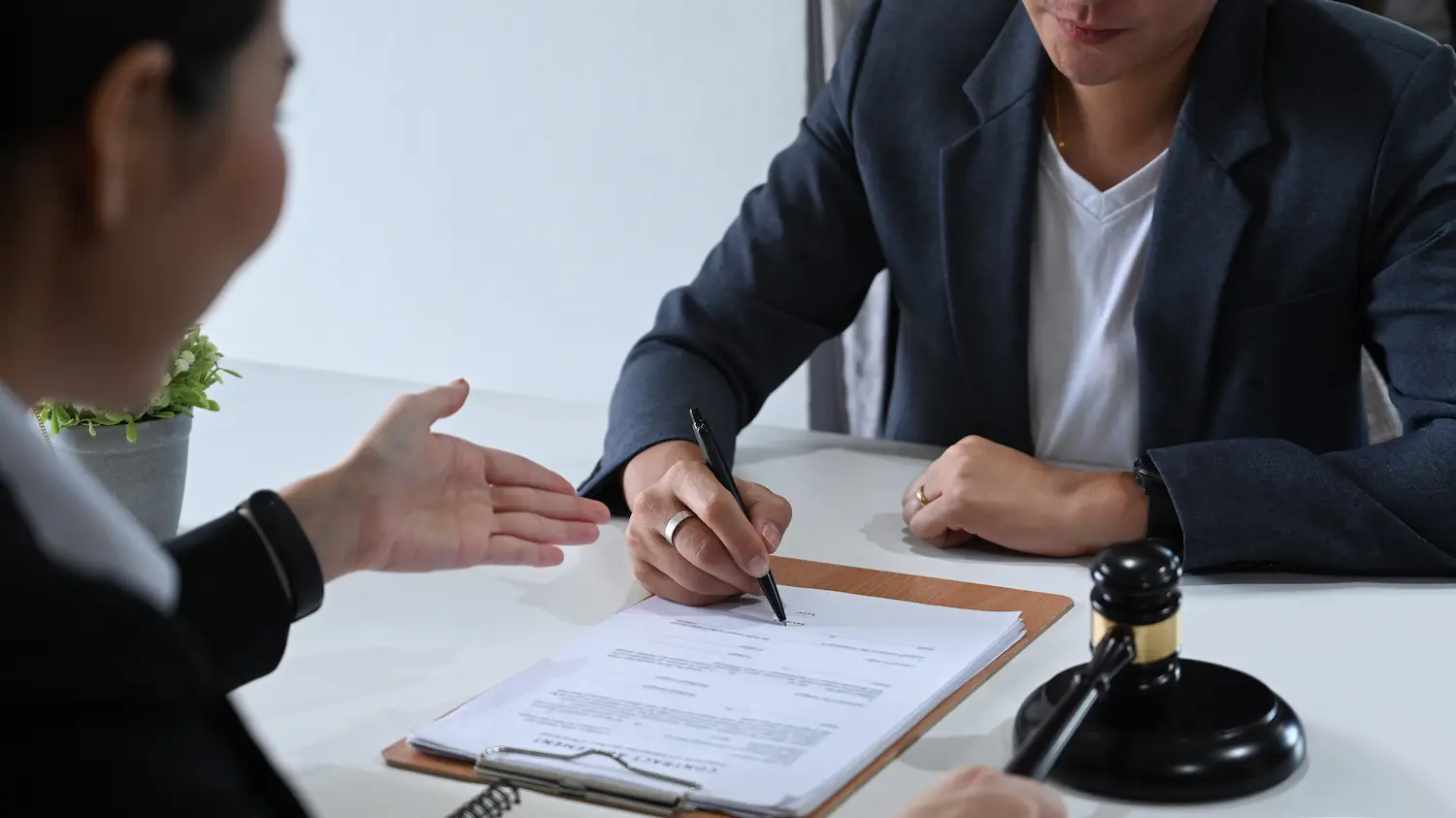 Lawyer completing paperwork for modifications to a case.